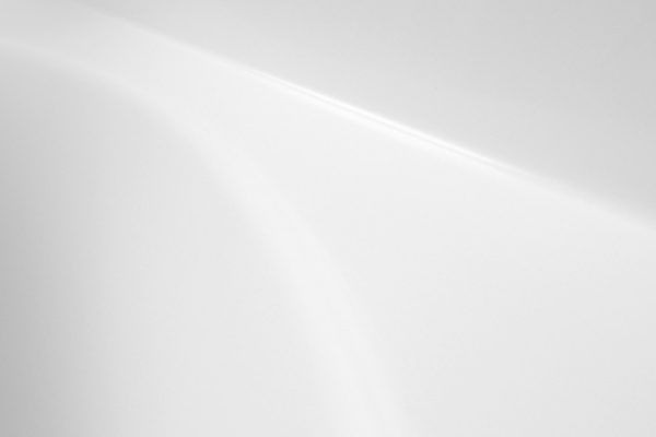 A minimal, plain white abstract with soft light and shadow