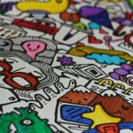 Green, white and yellow fabric with a playful cartoon car print