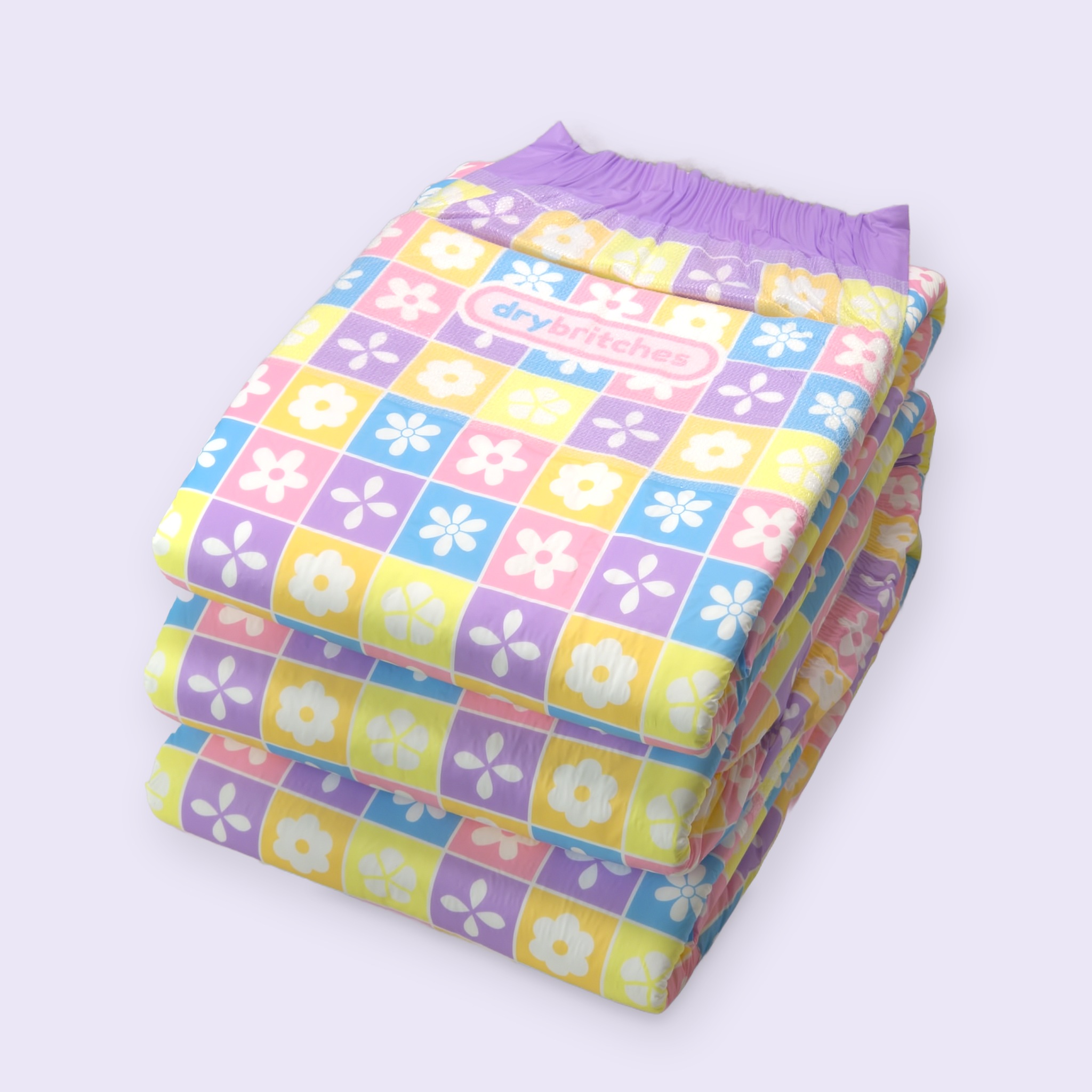 Three folded Posy diapers stacked on a lavender background