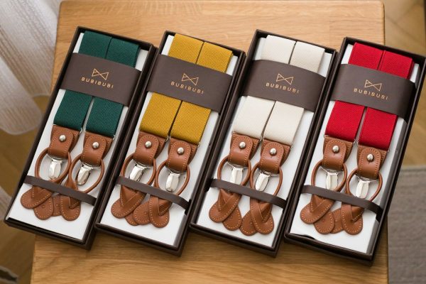 A set of suspenders laid out on a table