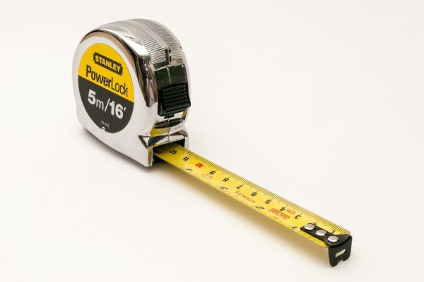A tape measure ready for taking waist and hip measurements