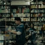 Shoppers inside a well-stocked pharmacy